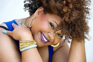 Afrobella wearing jewelry in an archived portrait from the studio spotlight.
