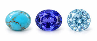 Illustration of turquoise, violet-blue tanzanite and icy-blue zircon on white