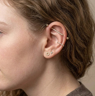 Upper-ear jewelry styling with long straight decorative bars