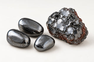 Editorial illustration of polished and rough metallic gray hematite