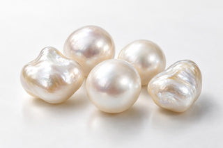 Editorial illustration of creamy cultured pearl forms