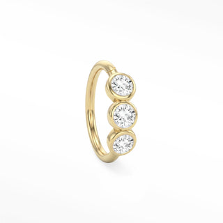 14K yellow gold trio seam ring with three round bezel-set lab-grown diamonds aligned along the hoop