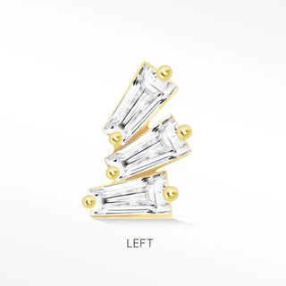 A gold-toned threadless flat ring with three staggered emerald-cut clear stones from the Wynning Studs collection
