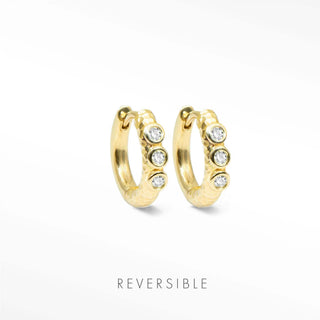 Telletubies 14k gold hoop earrings feature textured gold hoops with four clear round stones as fine jewelry