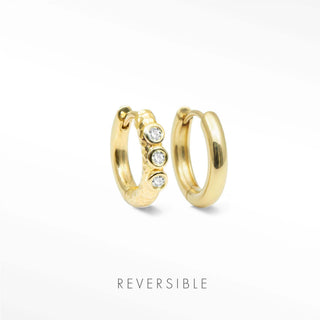 Telletubies 14k gold hoop earrings featuring gold hoop earrings with three clear stones in a textured band fine jewelry