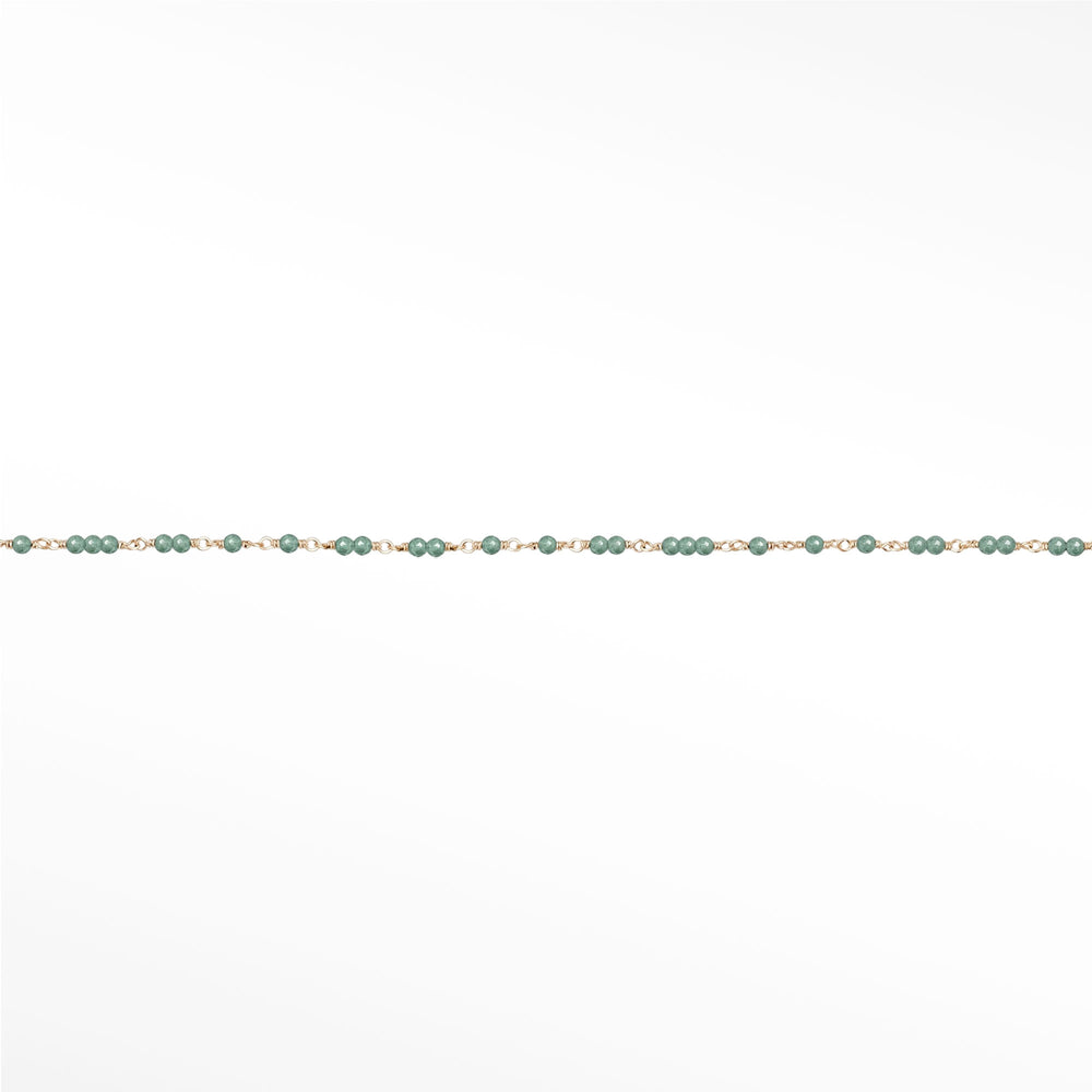 Comparison of red garnet, blue sapphire, pearl, ruby and emerald chain styles, with emerald at right.