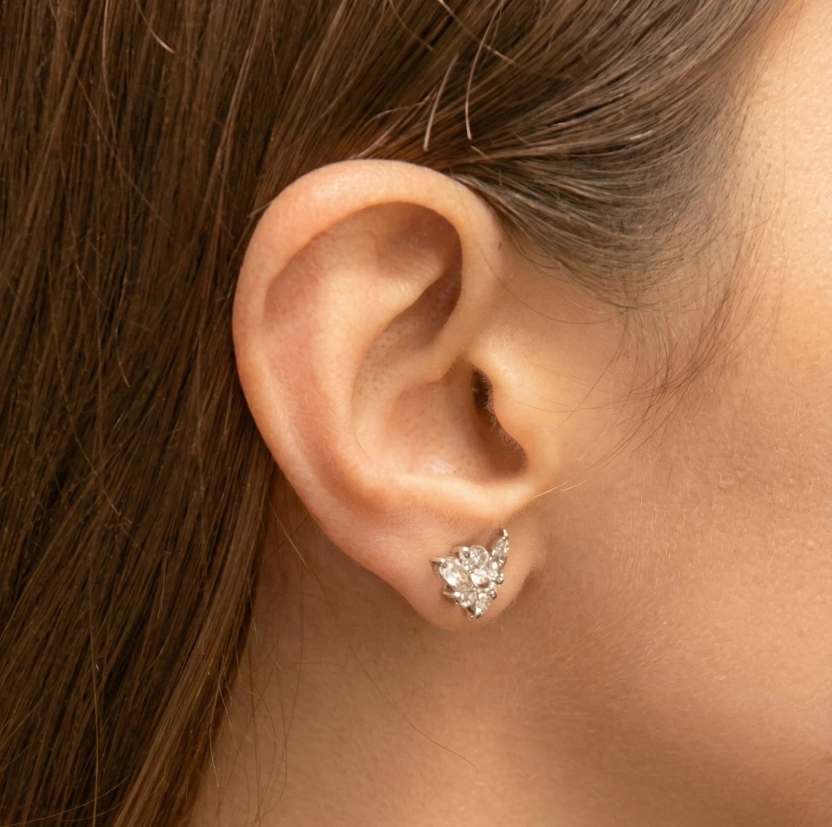 Professional piercing with flatback earrings