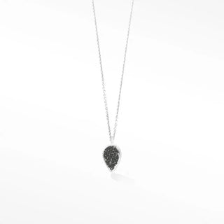 A delicate silver chain holds an adorn petite black druzy silver necklace with a teardrop-shaped black druzy pendant