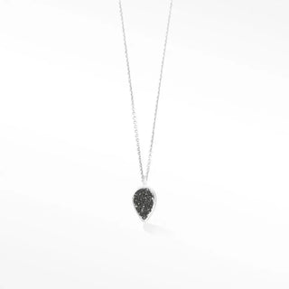 A delicate silver chain holds an adorn petite black druzy silver necklace with a teardrop-shaped black druzy pendant