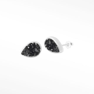 Teardrop-shaped petite black druzy silver stud earrings with black druzy interior in sleek white metal frame