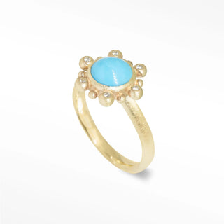 A delicate athena 7mm sleeping beauty gold 14k ring with vibrant turquoise and sparkling diamond accents