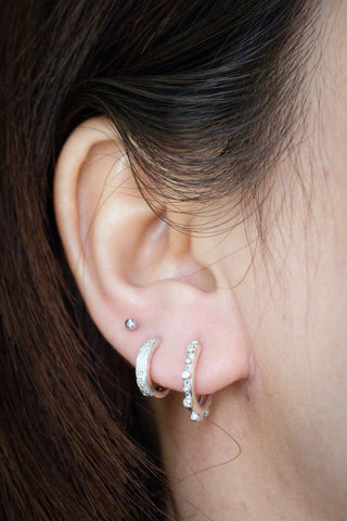 Silver reversible huggies athena diamond sterling silver 15mm hoops with embedded clear crystals adorn the ear
