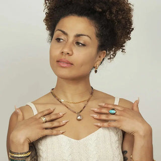 A delicate baby paperclip gold vermeil necklace 18 inch featuring a single lustrous pearl pendant