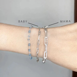 Silver baby paperclip silver bracelet 7 inch set labeled baby and mama with blue gemstone detail on one bracelet