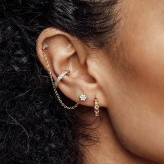 Gold-toned cartilage hoop earring with pavé stones and delicate chain in 14k yellow gold from nina wynn denver