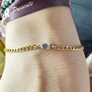 Gold-toned curb chain bracelet with rectangular clear gemstone available for book permanent jewelry nina wynn appointment