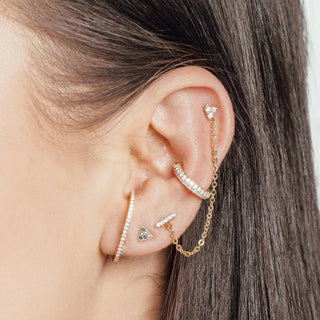 Gold-toned ear cuff with clear crystals and chain extension by nina wynn for piercing jewelry ear piercing denver appointment