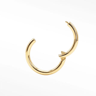 Gold-colored polished 14k gold cartilage hoop earrings with sleek minimalist hinged hoop design