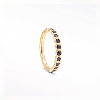 Cartilage hoop earrings featuring striking black diamonds in a bezel eternity setting. This 16g 14k yellow gold adds