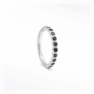 Cartilage hoop earrings featuring striking black diamonds in a bezel eternity setting. This 16g 14k white gold adds