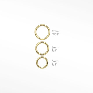 Cartilage hoop earrings with a handcrafted 18g hammered texture. Add an organic light-catching glow to your 14k gold