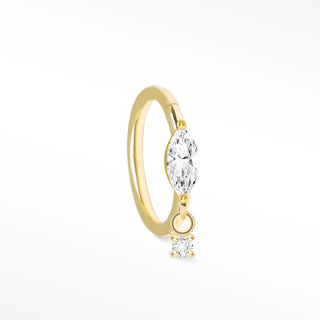 Delicate 14k gold cartilage hoop earrings featuring a marquise-cut clear gemstone and a smaller dangling diamond
