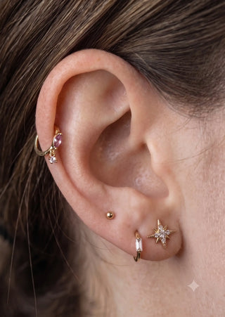 Cartilage hoop earrings with a 14k gold baguette lab diamond. Handcrafted for snug fit and modern glow this 18g design