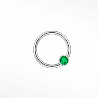 Cartilage hoop earrings in 14k white gold with a bezel-set emerald. Display vibrant forest-green glow your ear stack