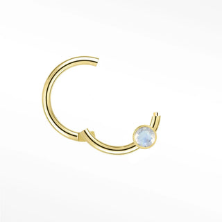 Cartilage hoop earrings in 14k gold with a bezel-set moonstone. Capture luminous ethereal glow for your ear stack