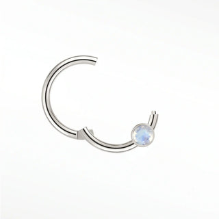 Cartilage hoop earrings in 14k white gold with a bezel-set moonstone. Capture luminous ethereal glow for your ear stack