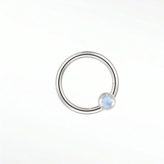 Cartilage hoop earrings in 14k white gold with a bezel-set moonstone. Capture luminous ethereal glow for your ear stack