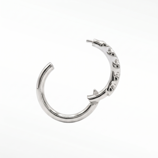 Cartilage hoop earrings showcasing a striking line of bezel-set black diamonds in 14k white gold. Infuse dark modern