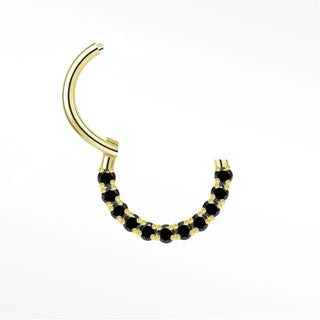 Cartilage hoop earrings in 14k gold with a bold black diamond arc. Contrast warm mysterious obsidian stones
