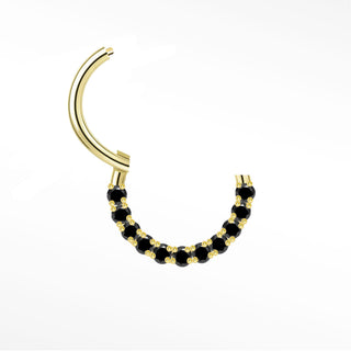 Cartilage hoop earrings in 14k gold with a bold black diamond arc. Contrast warm mysterious obsidian stones