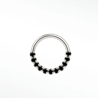 Cartilage hoop earrings in 14k white gold with a bold black diamond arc. Contrast warm mysterious obsidian stones
