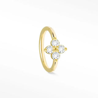 A delicate 14k yellow gold cartilage hoop earring with a small diamond clover design and clear cubic zirconia stones