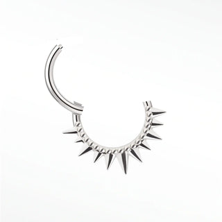 Cartilage hoop earrings in 14k white gold featuring a bold spiked sunburst design. Own modern architectural statement