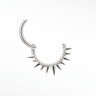 Cartilage hoop earrings in 14k white gold featuring a bold spiked sunburst design. Own modern architectural statement