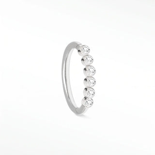 Cartilage hoop earrings in 14k white gold featuring a seamless line of bezel-set lab diamonds. Illuminate your ear