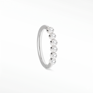 Cartilage hoop earrings in 14k white gold featuring a seamless line of bezel-set lab diamonds. Illuminate your ear