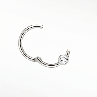 Cartilage hoop earrings in 14k white gold with a bezel-set lab diamond. Highlight your curation this clean minimalist