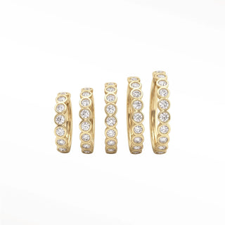 Cartilage hoop earrings with lab grown diamonds in a bezel eternity style. This 16g 14k gold adds brilliant sparkle
