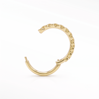 Cartilage hoop earrings featuring striking black diamonds in a bezel eternity setting. This 16g 14k yellow gold adds