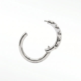 Cartilage hoop earrings featuring striking black diamonds in a bezel eternity setting. This 16g 14k white gold adds