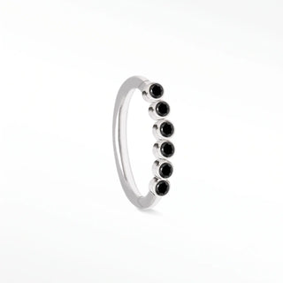 Cartilage hoop earrings featuring striking black diamonds in a bezel eternity setting. This 16g 14k white gold adds