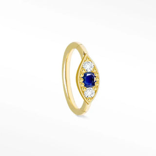 A delicate cartilage hoop earring featuring a blue sapphire and evil eye 14k yellow gold design with white diamonds