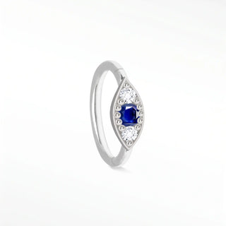 Cartilage hoop earrings with blue sapphire and diamond evil eye in 14k white gold. Handcrafted for protection
