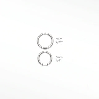 Cartilage hoop earrings featuring a turquoise and diamond evil eye motif in 14k white gold. Channel protection vibrant