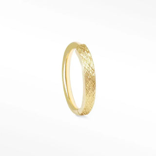 A sleek florentine 14k yellow gold cartilage hoop earring with a textured woven pattern and smooth finish 18g