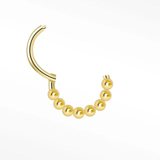 Cartilage hoop earrings by nina wynn featuring a handcrafted 14k yellow gold granulation design. This luxury clicker